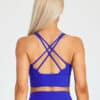 Model wearing fiit pixie sports bra in Royal Blue